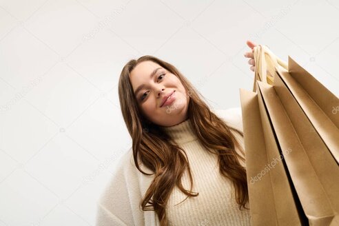 Cinta métrica sobre prendas de ropa para guía de tallas